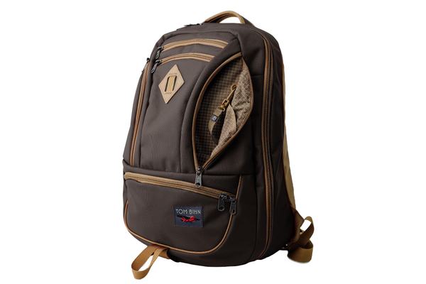 The Guide's Edition Synik 30 in Brown 630 Ballistic. Brown backpack with gold accents on a white background